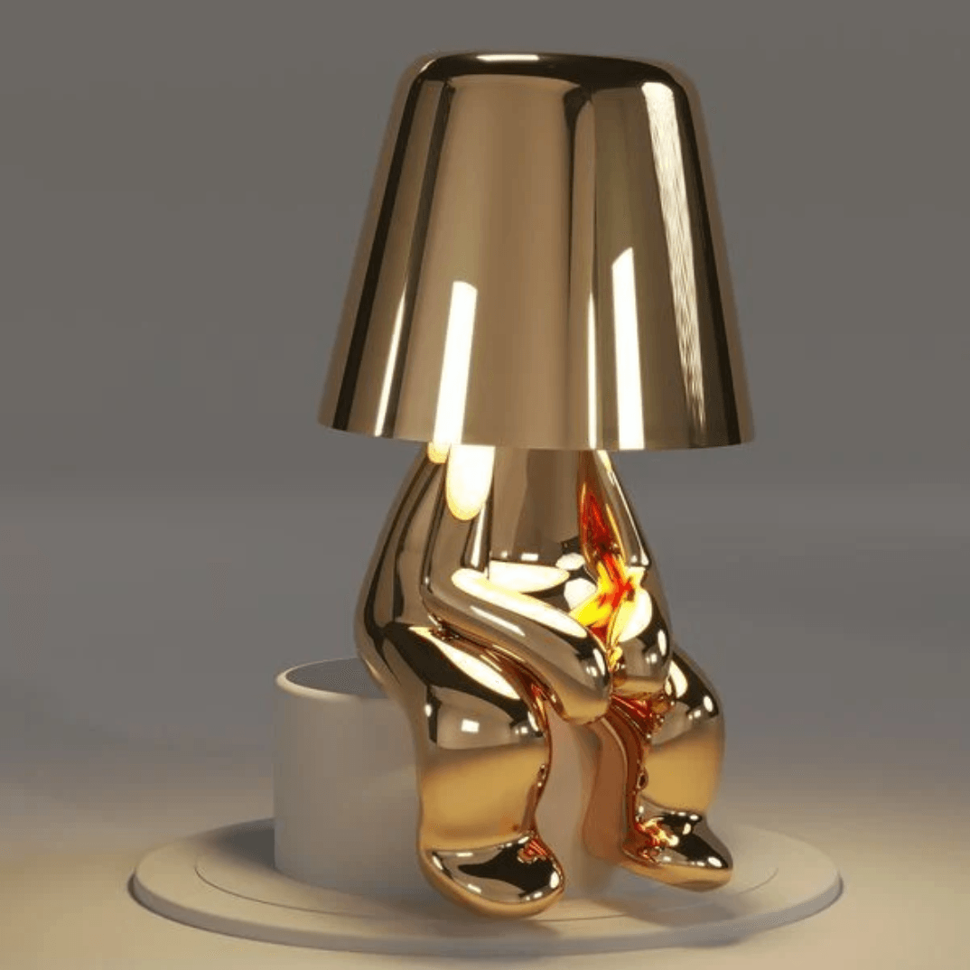 Thinker Brothers Table Lamp, a stylish Italian design with a gold figurine base and minimalistic elegance.