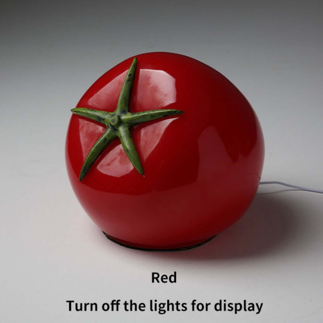 Tomato night light in red color with green stem, perfect bedside lamp for fun and quirky home décor.