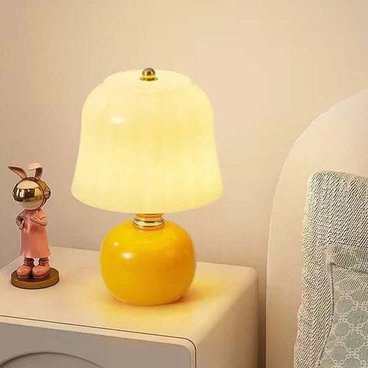 French cream mushroom table lamp on bedside table with decorative figurine