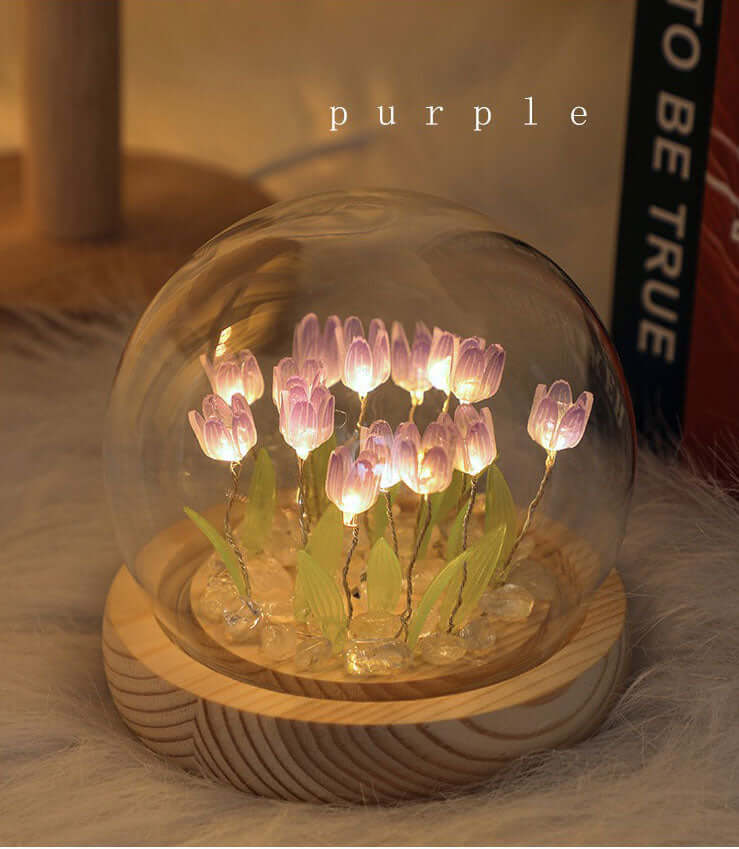 Handmade tulip lamp in a glass dome, featuring glowing purple tulips and a wooden base, perfect for night light gifts.