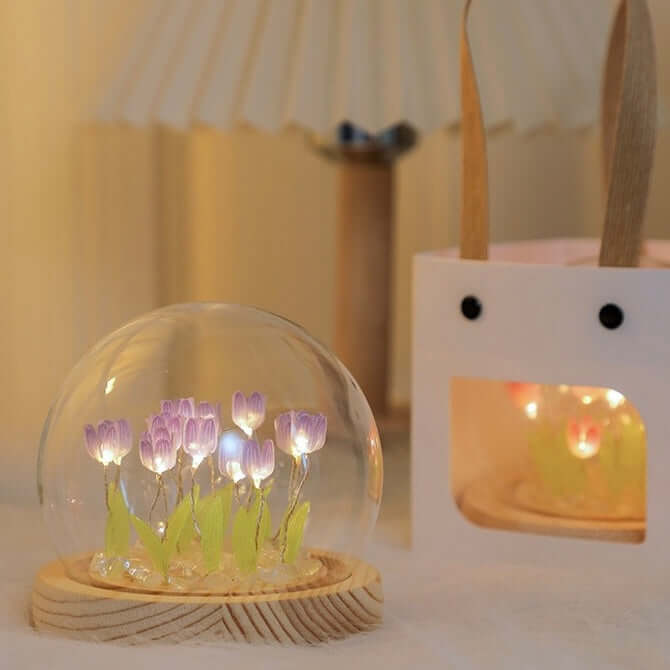 Warm glowing tulip night light under glass dome for cozy ambiance