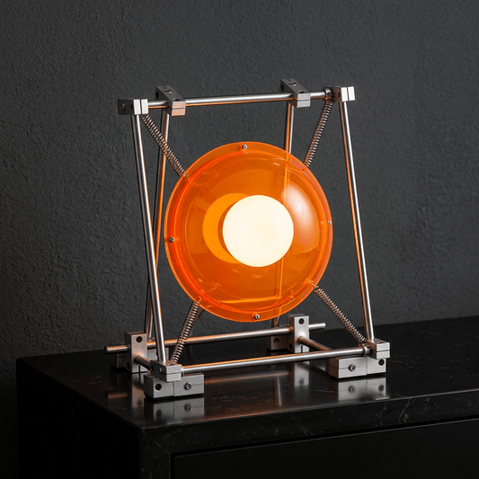 Orange acrylic table lamp illuminated with neutral white light