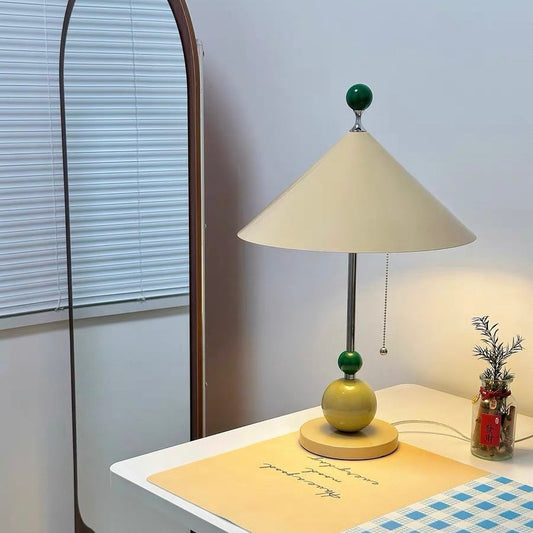 A stylish lamp featuring dopamine decor colors, brightening a cozy workspace with cheerful design elements.