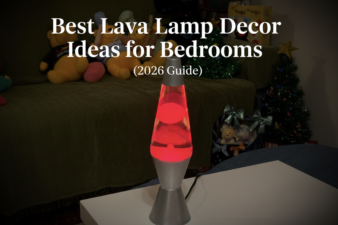 A glowing red lava lamp with a silver base on a white table, with the blog title "Best Lava Lamp Decor Ideas for Bedrooms (2026 Guide)" overlaid in white serif text, cozy bedroom setting with stuffed animals and a Christmas tree in the background.