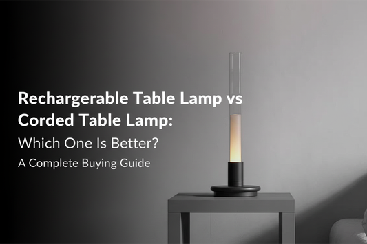 modern rechargeable cordless table lamp with warm amber glow against a grey minimalist bedroom background, with headline text: Rechargeable Table Lamp vs Corded Table Lamp: Which One Is Better?`