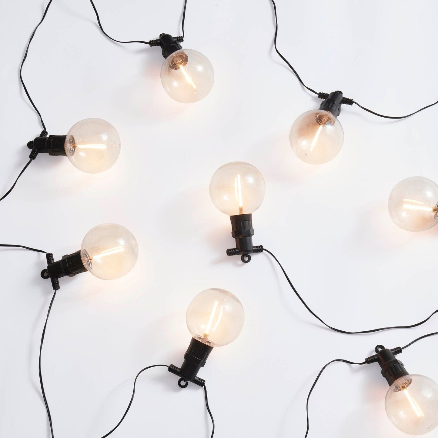 Patio string lights with exposed bulbs and hook hanging design