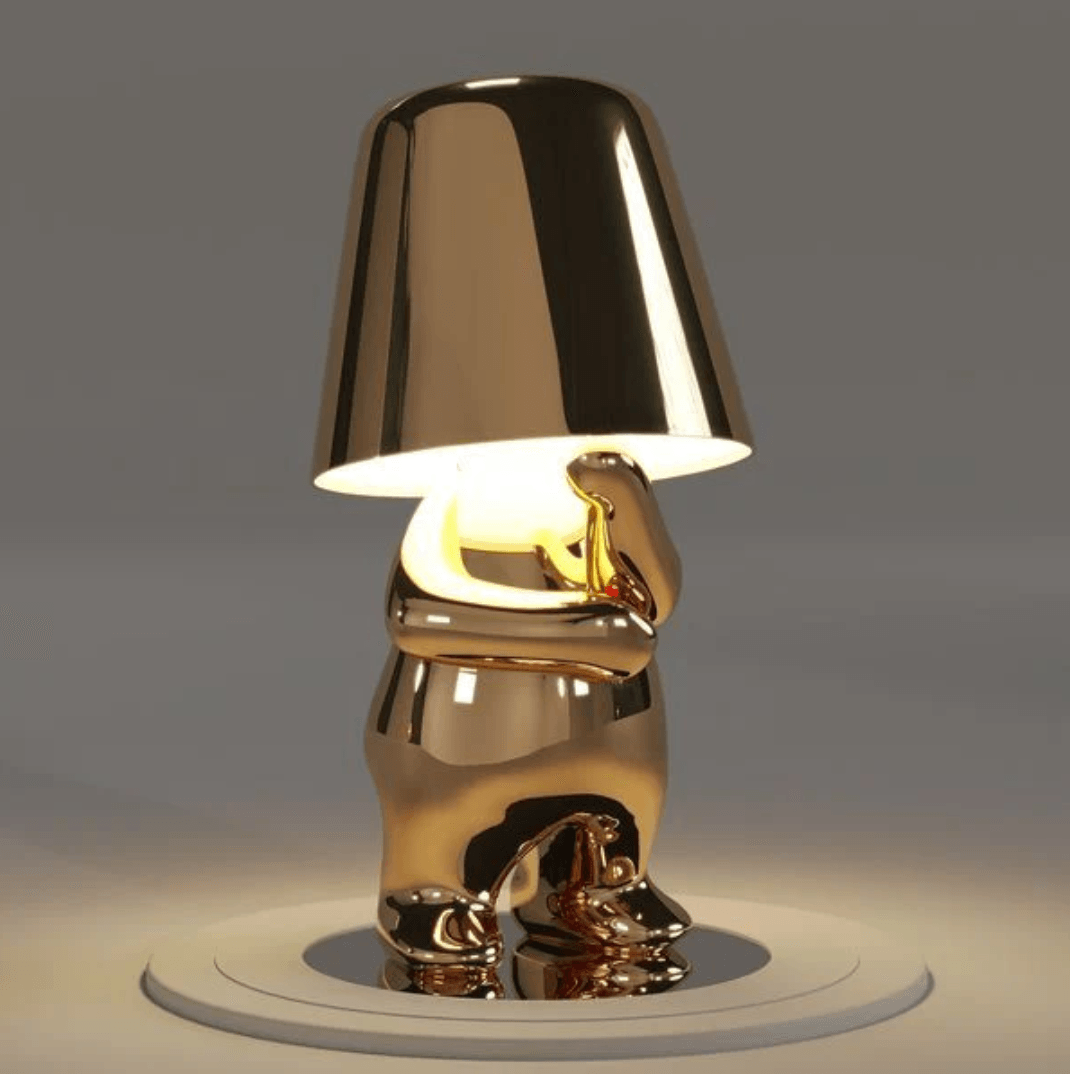 Gold Thinker Brothers Table Lamp with a playful design, combining elegance and functionality for modern interiors.