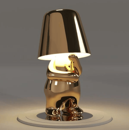 Gold Thinker Brothers Table Lamp with a playful design, combining elegance and functionality for modern interiors.