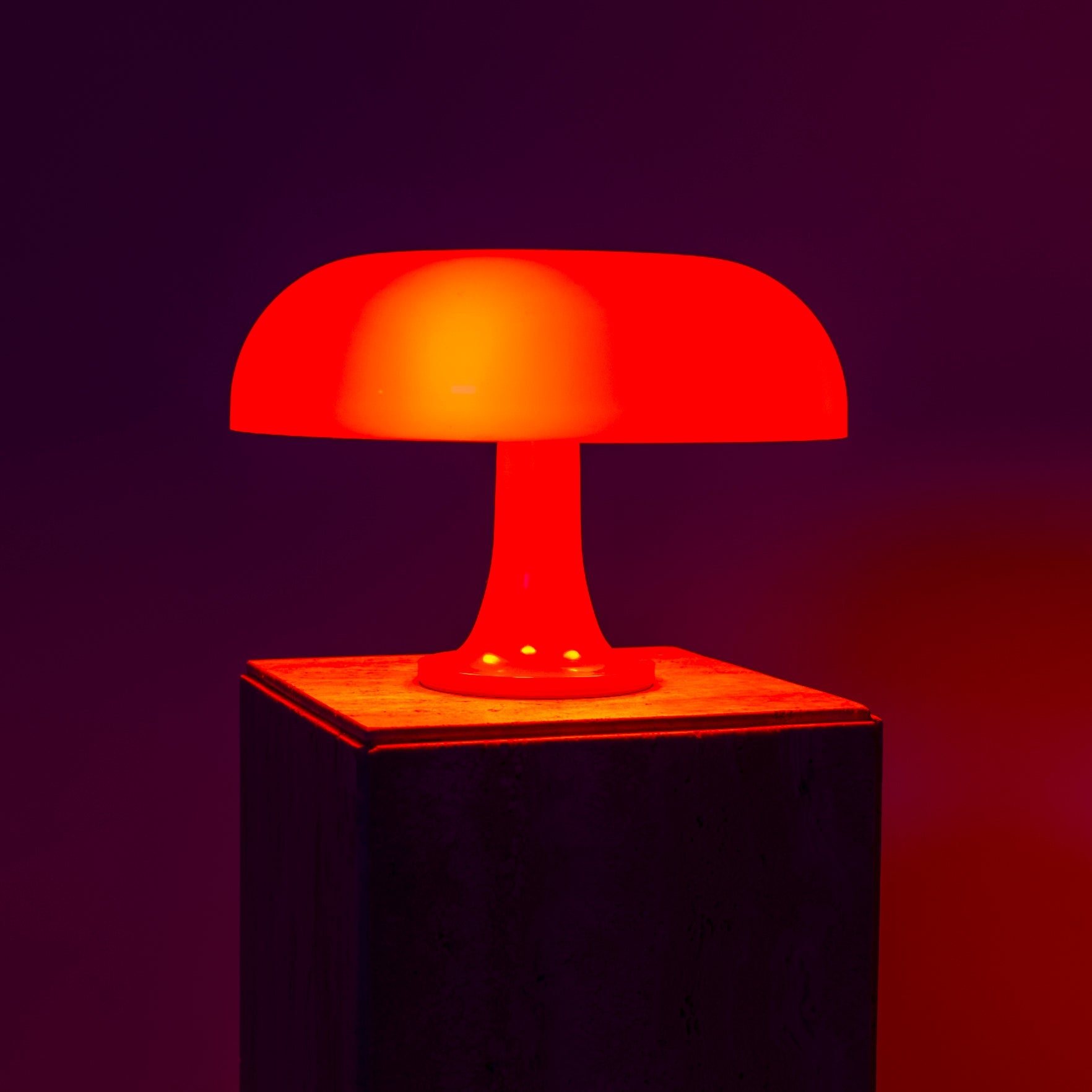 Lumiosa mushroom table lamp in vibrant red, showcasing Italian design and adjustable brightness for stylish interiors.
