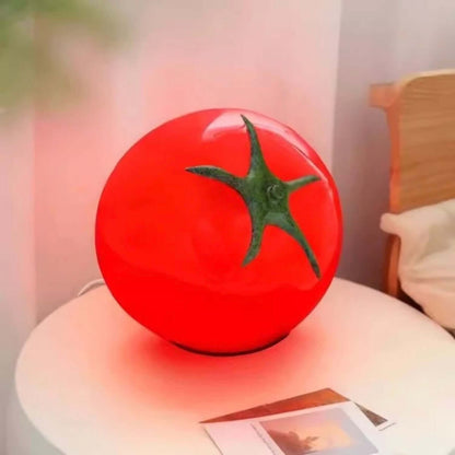 Tomato Night Light on a table, featuring a cute tomato shape and dimmable LED light for cozy ambiance.