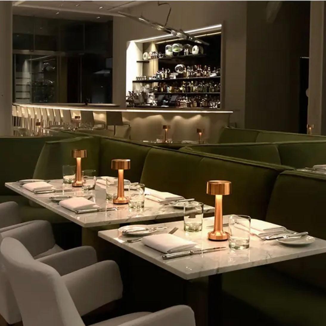 Dublin table lamp on a dining table in a stylish restaurant, highlighting Scandinavian minimalist design.