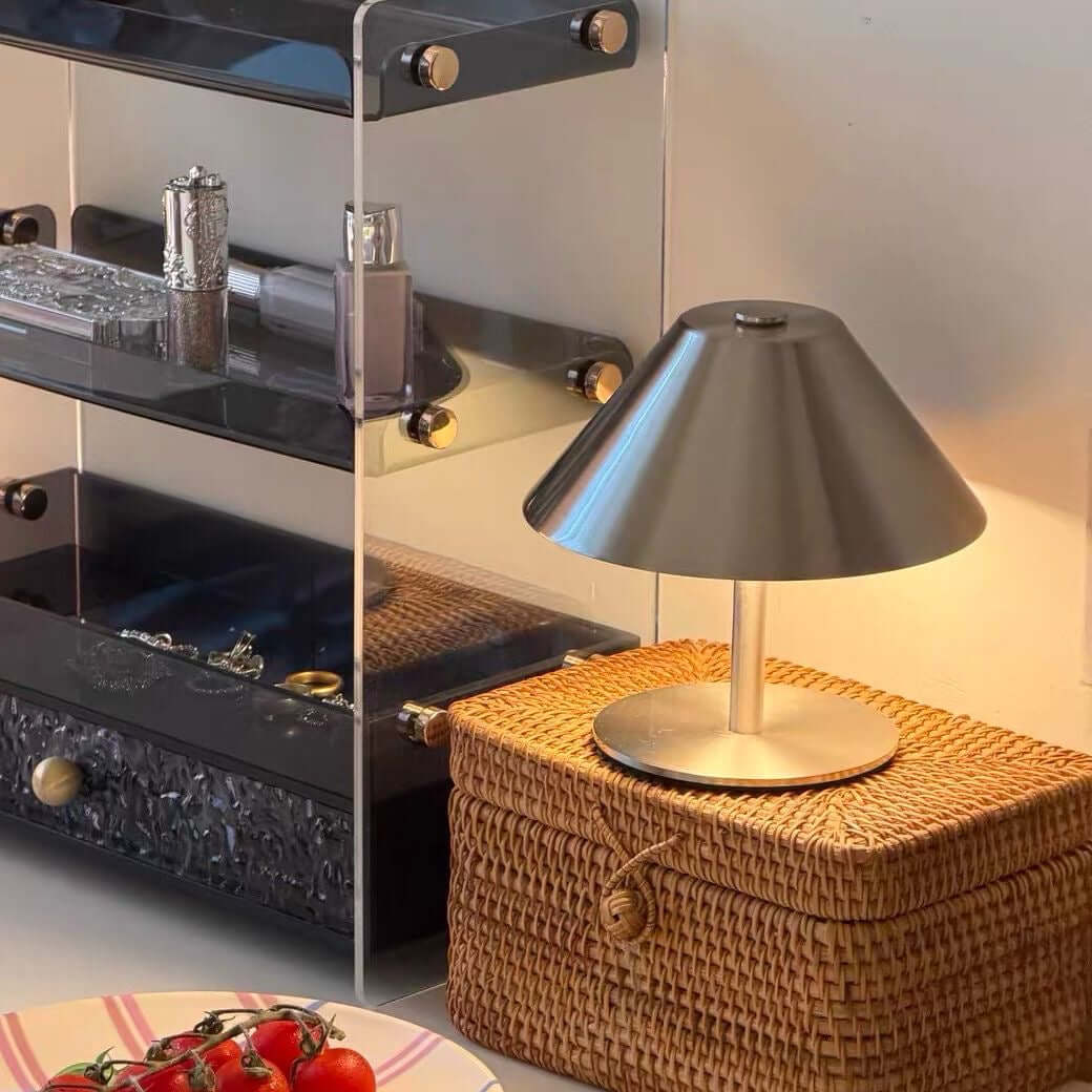Rechargeable metal table lamp on a café table