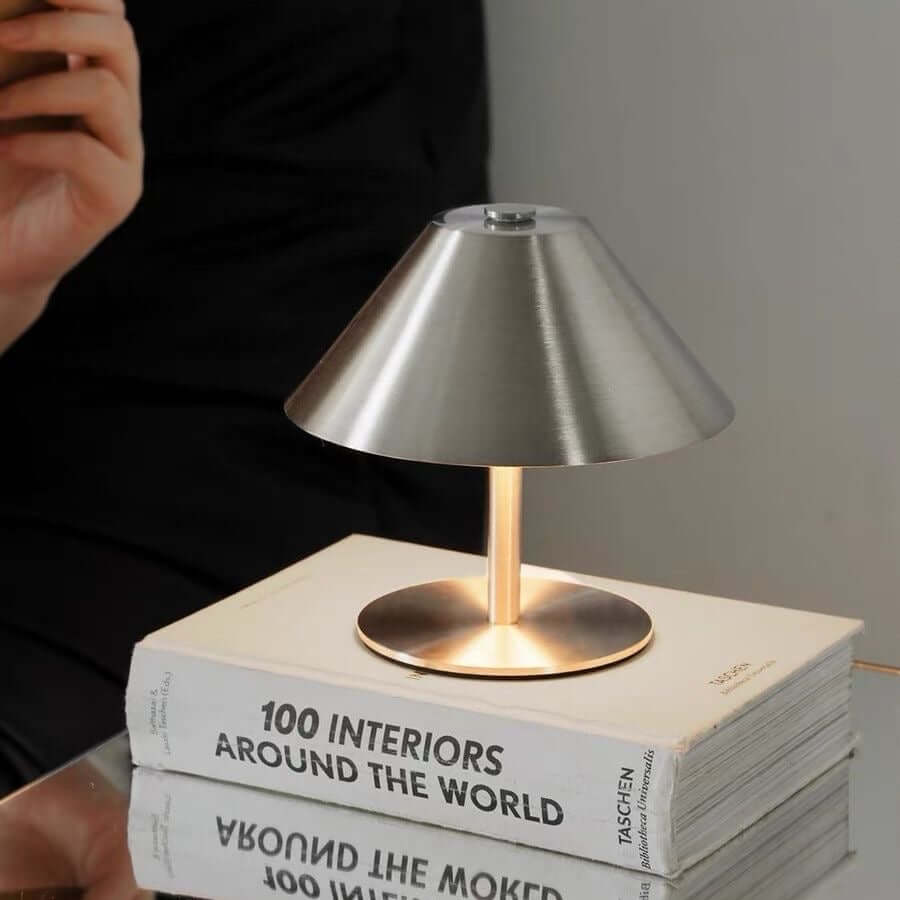 Umbrella metal table lamp on a modern bedside table