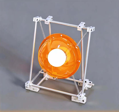 Sculptural orange acrylic table lamp with stainless steel frame and exposed springs