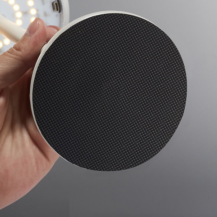 Close-up of the base of Tokyo table lamp, showcasing its textured black surface and minimalist design.