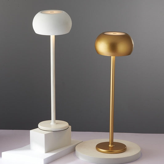 Tokyo table lamp in white and gold, showcasing Scandinavian modern design and elegant cordless functionality.
