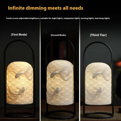 Ceramic Goldfish Lamp in three dimming modes, showcasing adjustable brightness for reading, relaxing, and sleep.