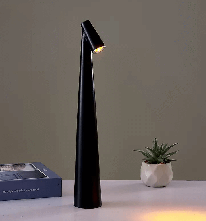 Sleek black touch-control LED desk lamp on a table, showcasing modern minimalist design and adjustable lighting features.