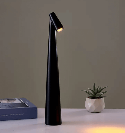 Sleek black touch-control LED desk lamp on a table, showcasing modern minimalist design and adjustable lighting features.