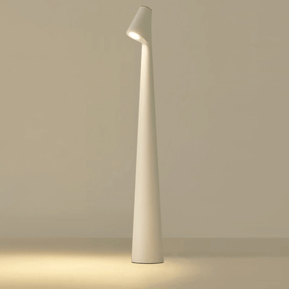 Modern minimalist white floor lamp with sleek design and unique angled lampshade.