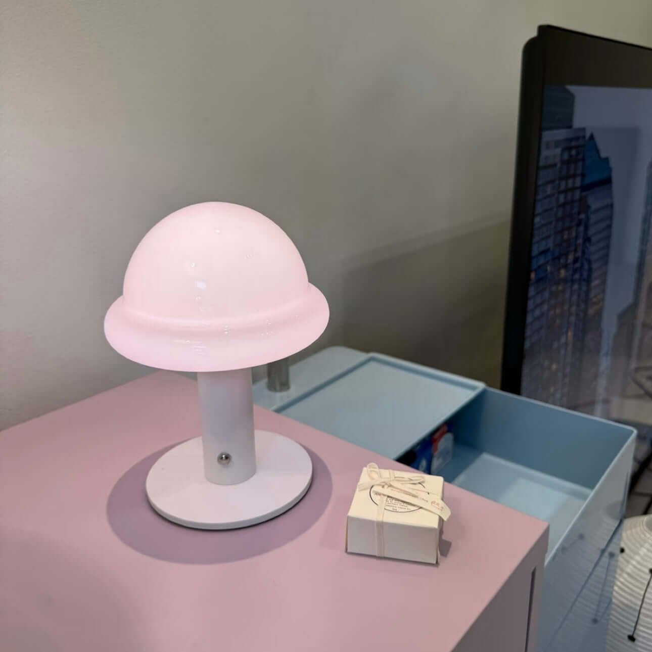 Pink Candy Table Lamp on a modern surface with a minimalistic design, ideal for mood lighting.