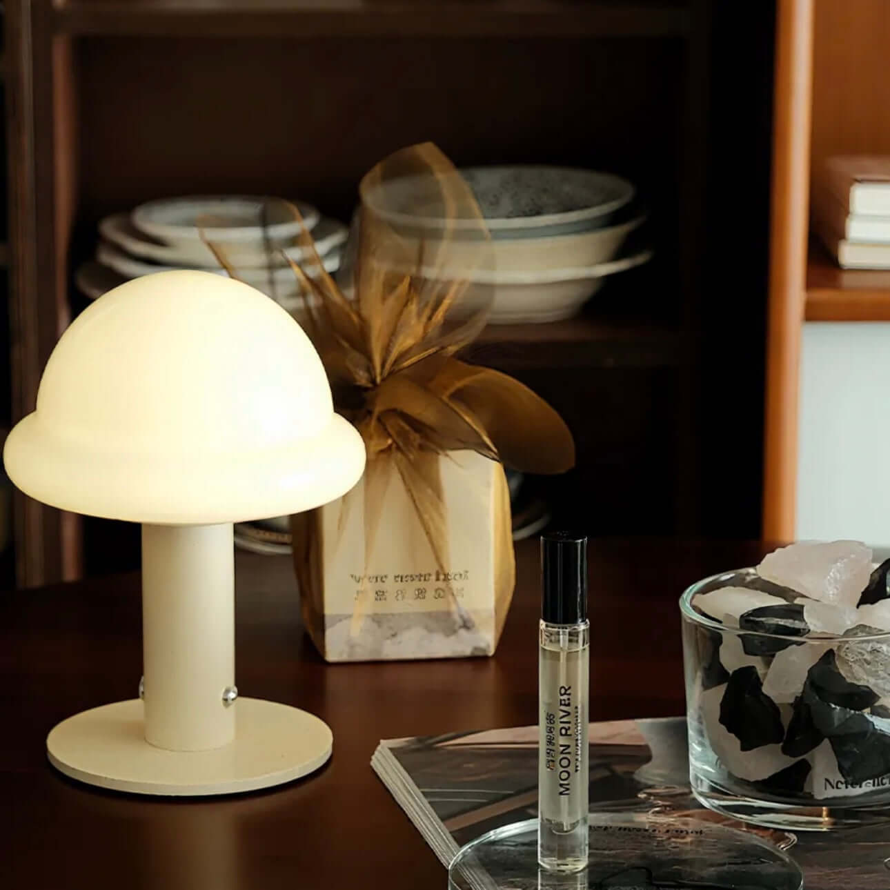 Candy Table Lamp illuminating a cozy table setting with decorative items, creating a warm and stylish ambiance.