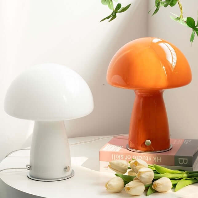 Mushroom table lamp with glass shade on bedside table