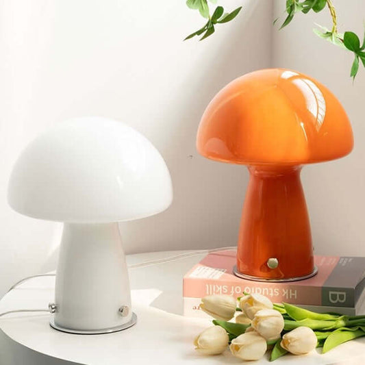 Mushroom table lamp with glass shade on bedside table