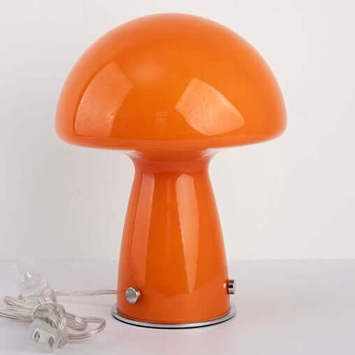 Orange mushroom table lamp with glossy glass shade, stylish design, perfect for any home decor.