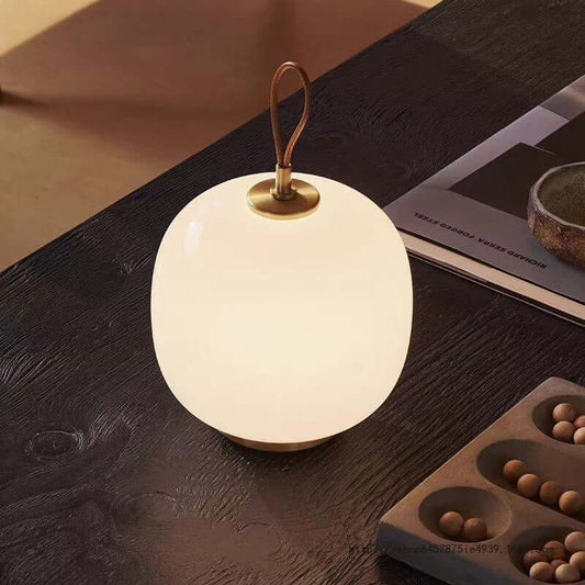 Danish portable table lamp with hand-blown opal glass on bedside table