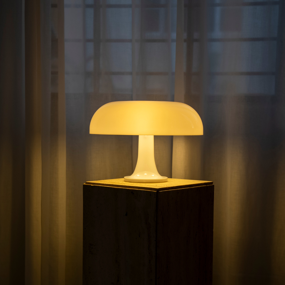 Lumiosa mushroom table lamp with soft glowing light, enhancing interior decor and offering touch control for brightness.