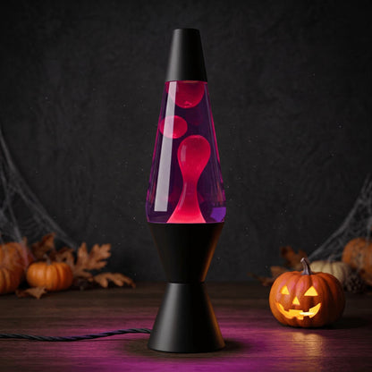 Lava lamp with a black base and cap, purple liquid, and red wax.