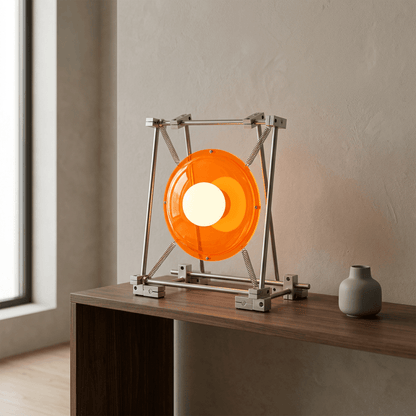 Orange sculptural table lamp on a walnut console in a minimalist interior