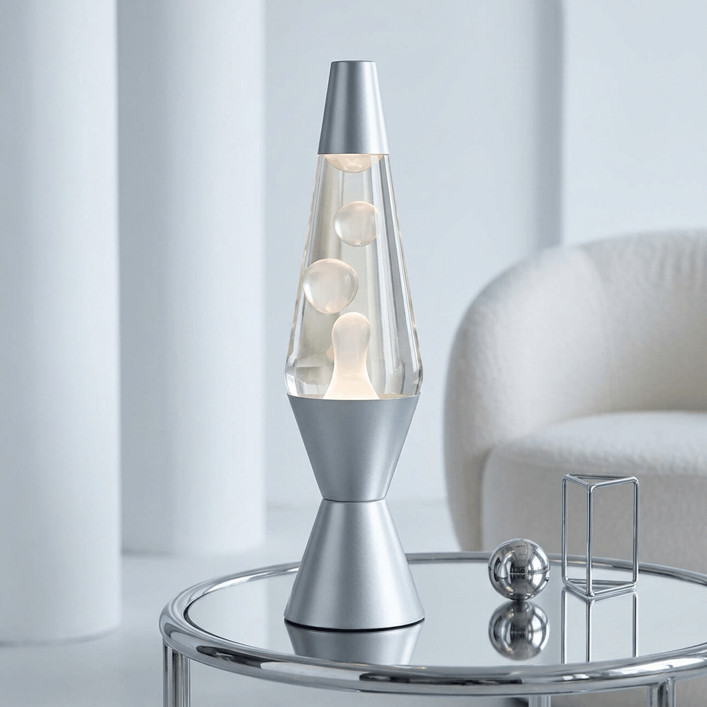Lava lamp with a sliver base and cap, clear liquid, and white wax.