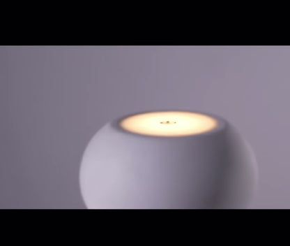 Close-up of Tokyo Table Lamp showcasing its sleek design and warm glow, emphasizing minimalist Scandinavian aesthetics.